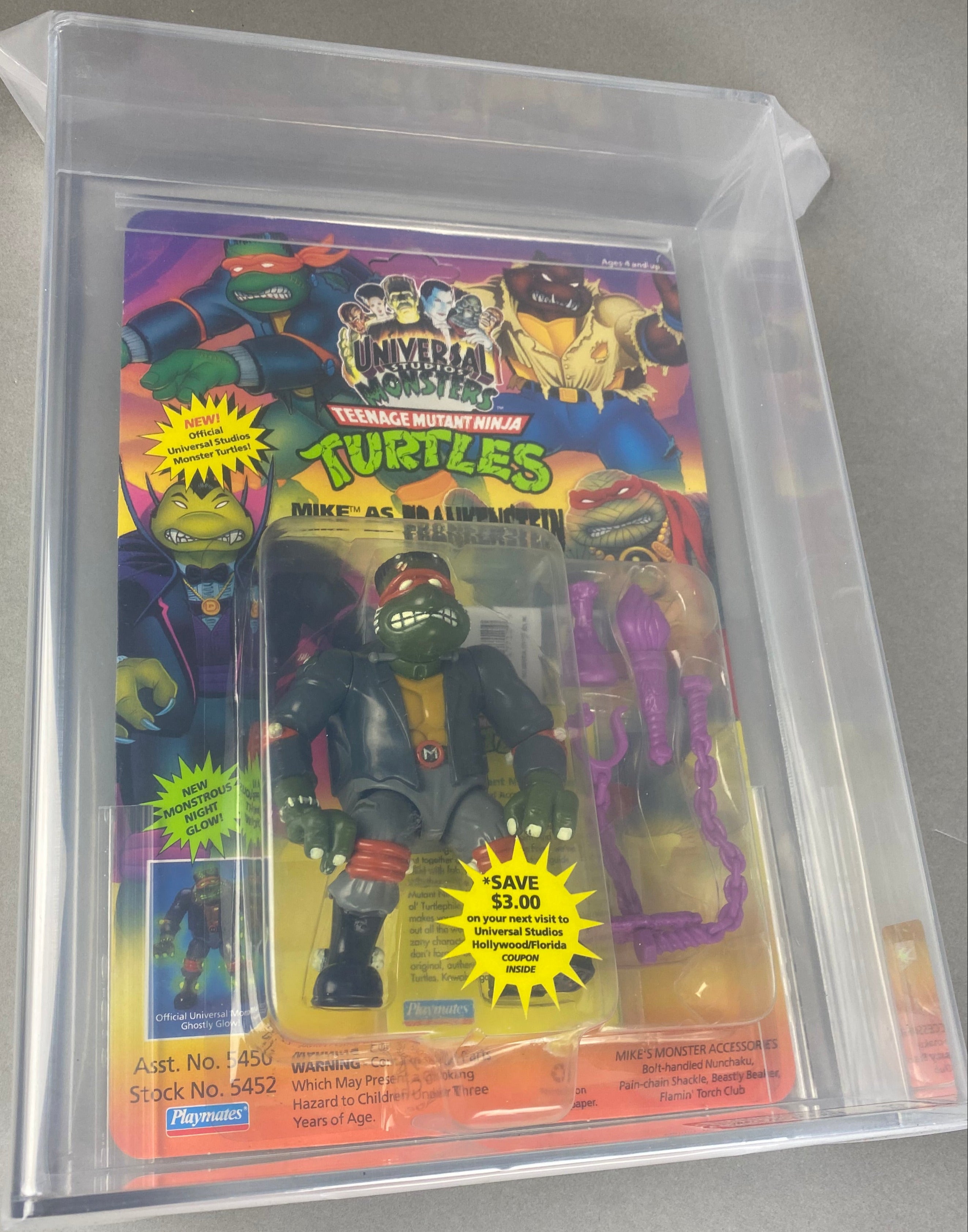 Teenage Mutant Ninja Turtles Mike as Frankenstein Universal Studios Monster boxed figure AFA graded 80. Front photo.